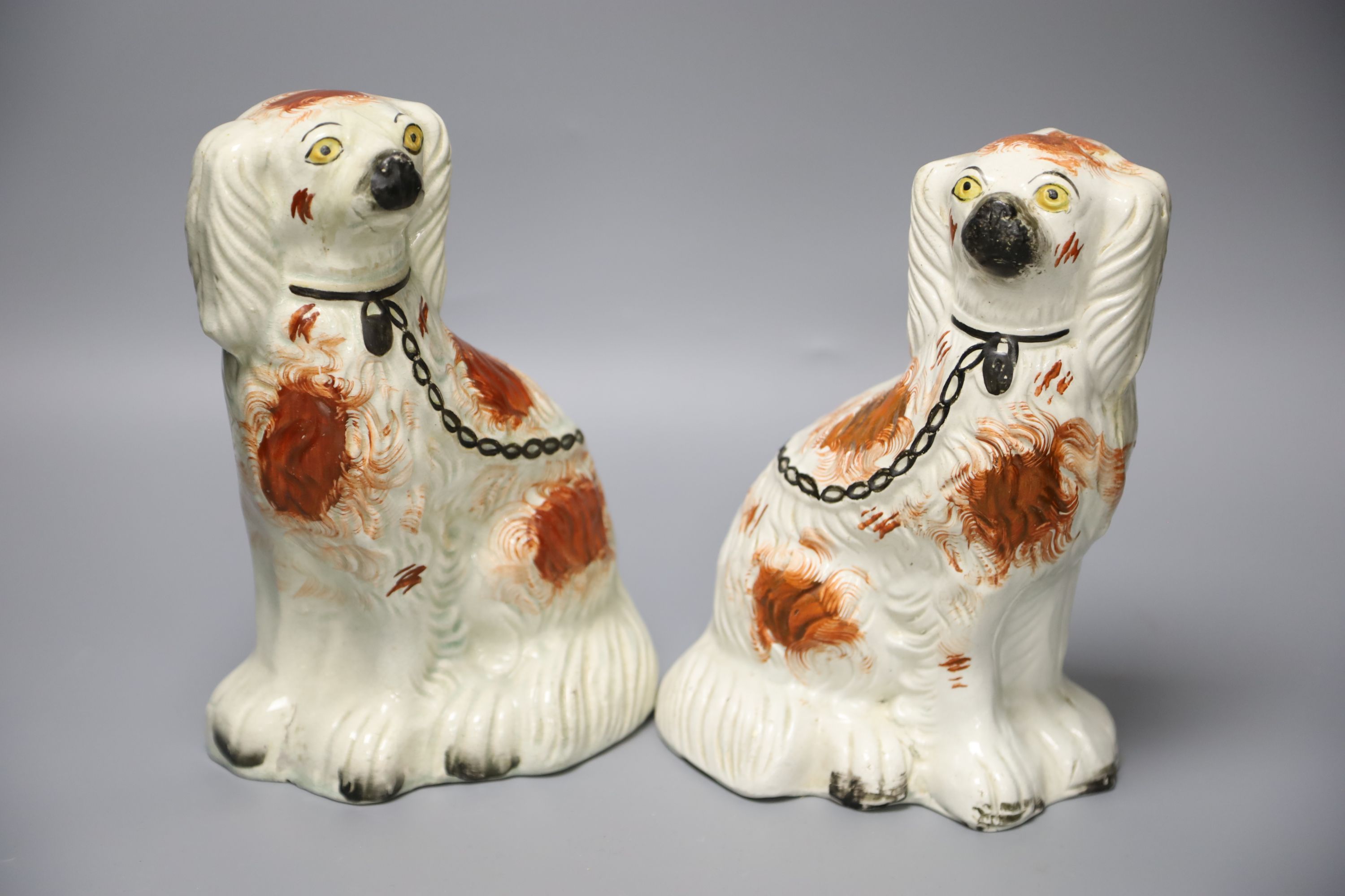 A pair of Staffordshire dogs, height 24cm